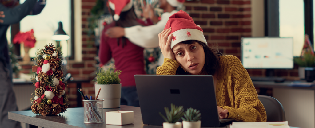 Lady working in an office, stressed during the Christmas period