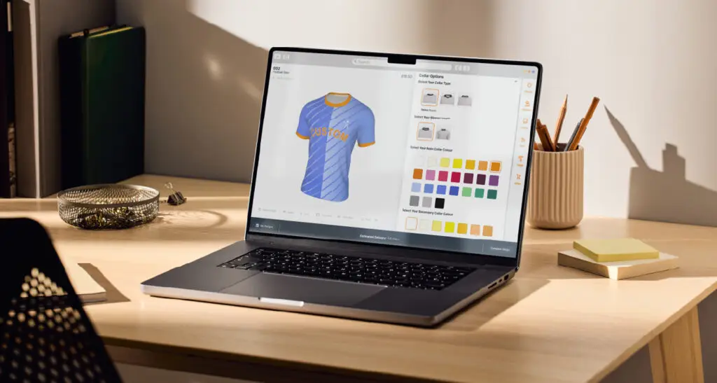 Laptop showing Kit Builder software. 3d product customisation of a football shirt in Kit Builder